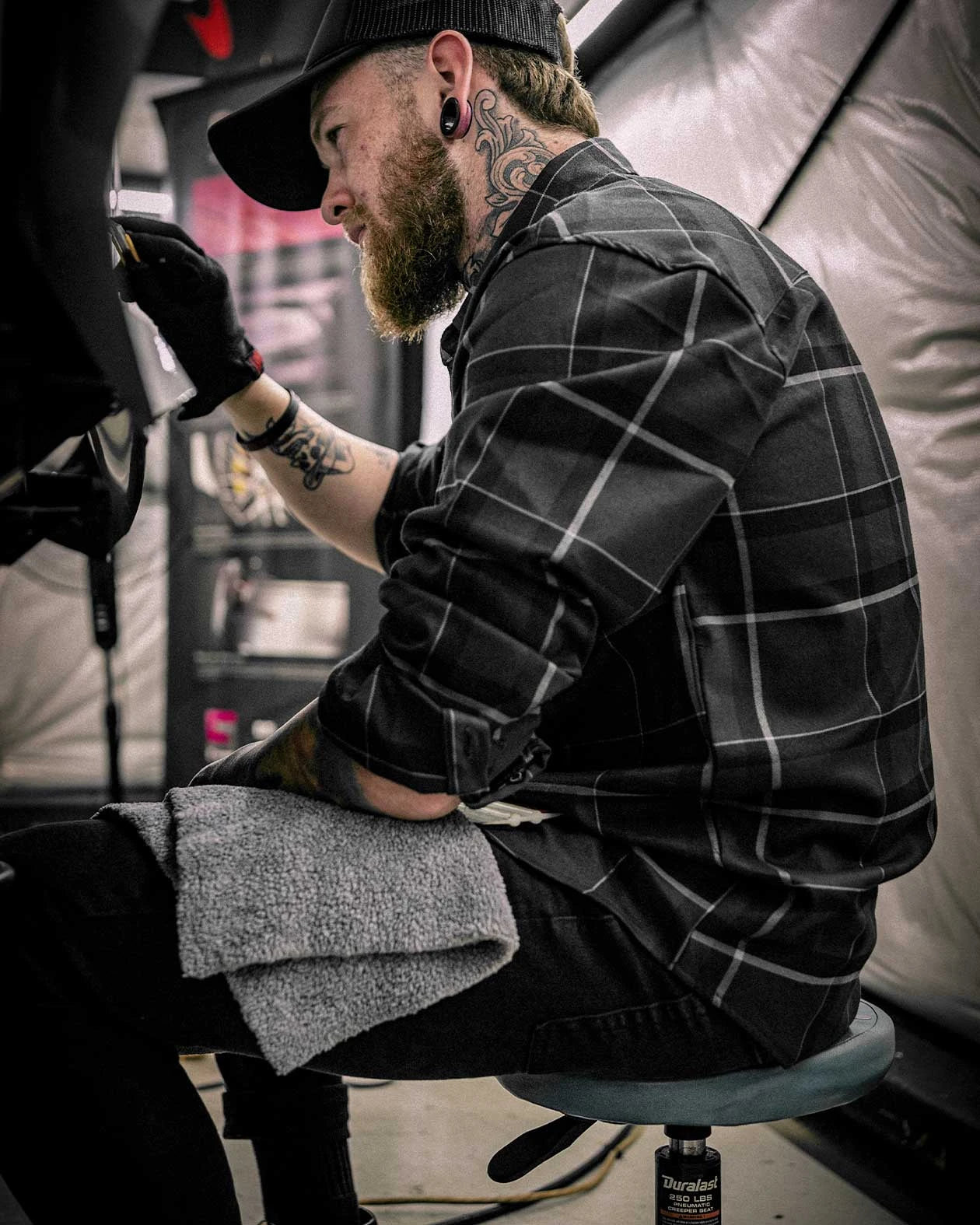 dapper flannel on a tattoo artist - gray and black flannel