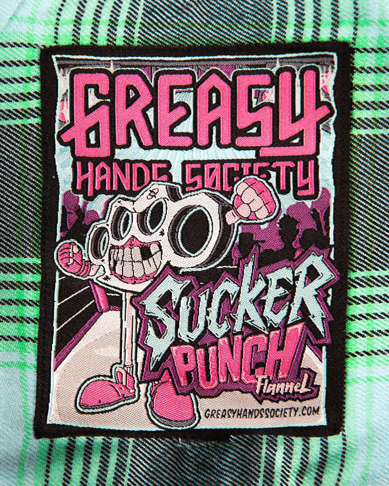 sucker punch blue and green lightweight flannel tag showing the name of the flannel - The Sucker Punch Flannel from Greasy Hands Society