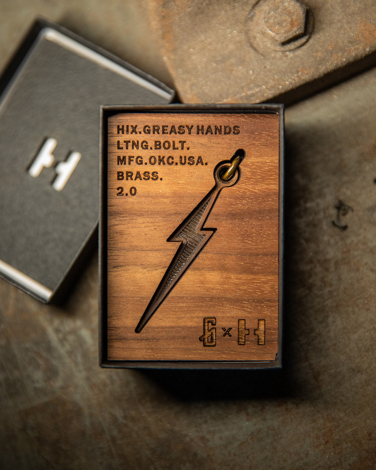brass lightning bolt pendant in the wood box it will be shipped in