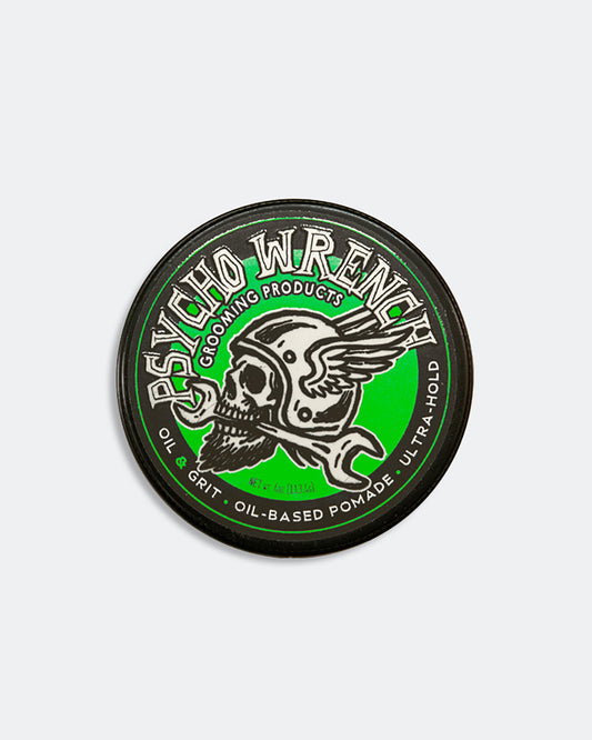 Round container of Psycho Wrench grooming product with skull design on a white background - oil and grit scent