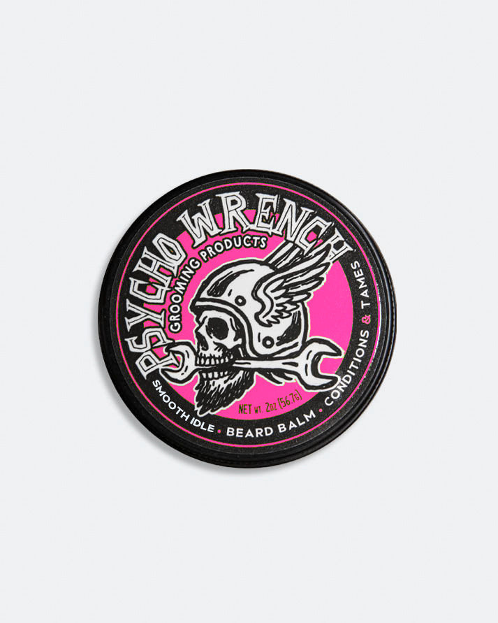 Beard balm container with 'Psycho Wrench' branding on a white background