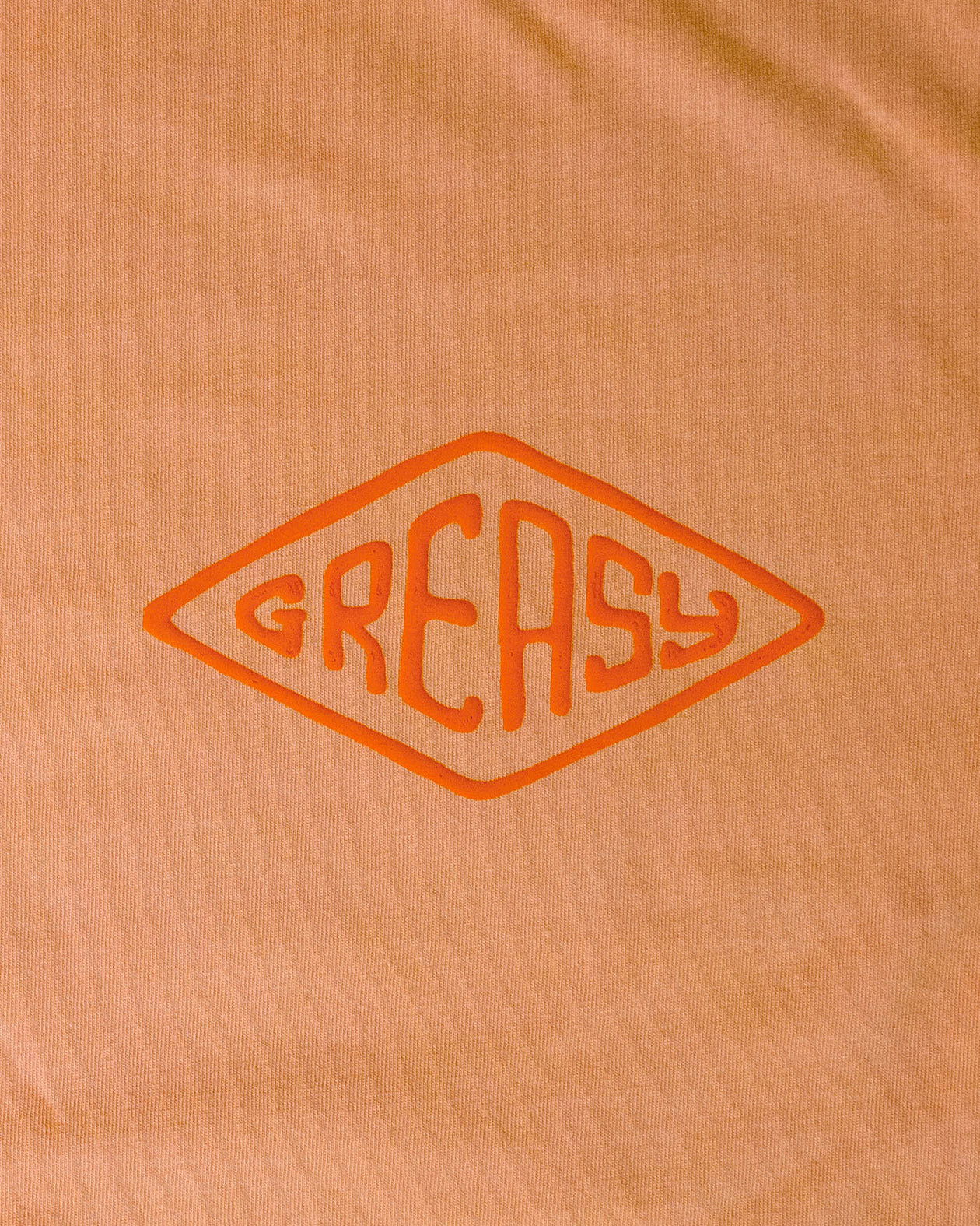cross the line vintage orange long sleeve graphic tee greasy diamond left chest detail