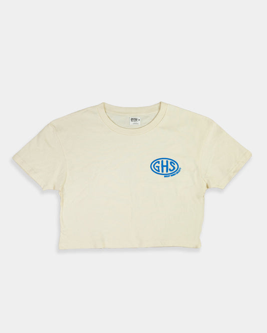 Beige crop top t-shirt with a blue logo on a white background