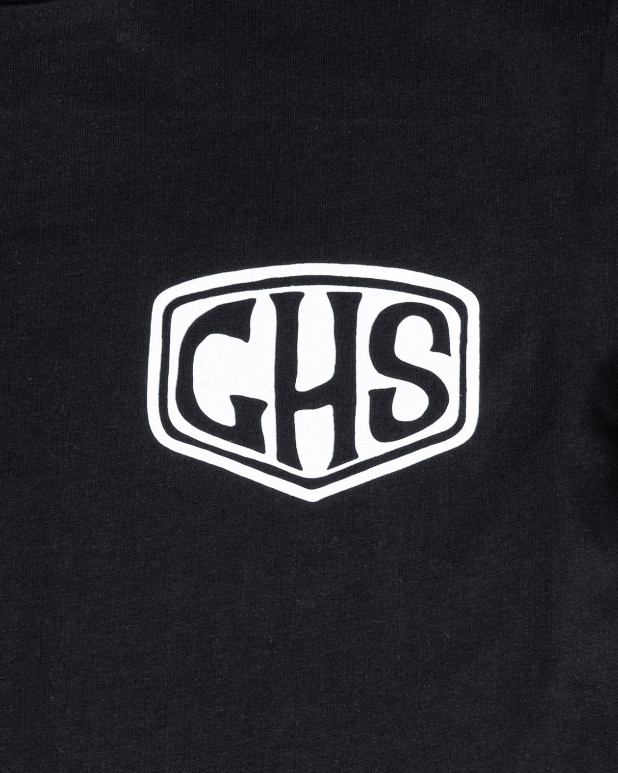factory sealed women's Black t-shirt with a white ghs shield logo on a black background close up on the shied