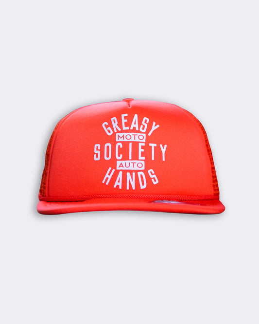orange station hat - ORANGE TRUCKER HAT with greasy hands society moto auto on the front flat lay front view on a gray background