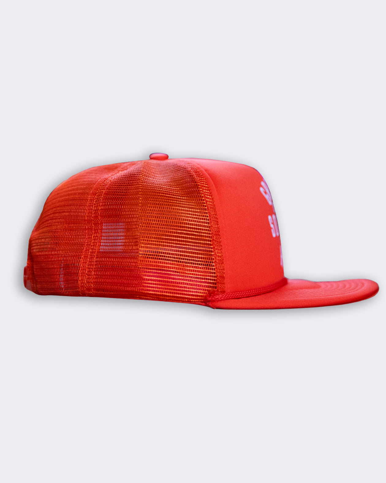 orange station hat with greasy hands society moto auto on the front flat lay side view on a gray background
