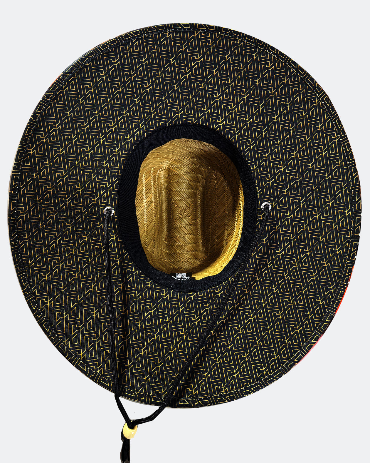 Black patterned wide-brimmed hat with a gold interior on a white background - Beach Roamer sun hat for men by Greasy Hands Society