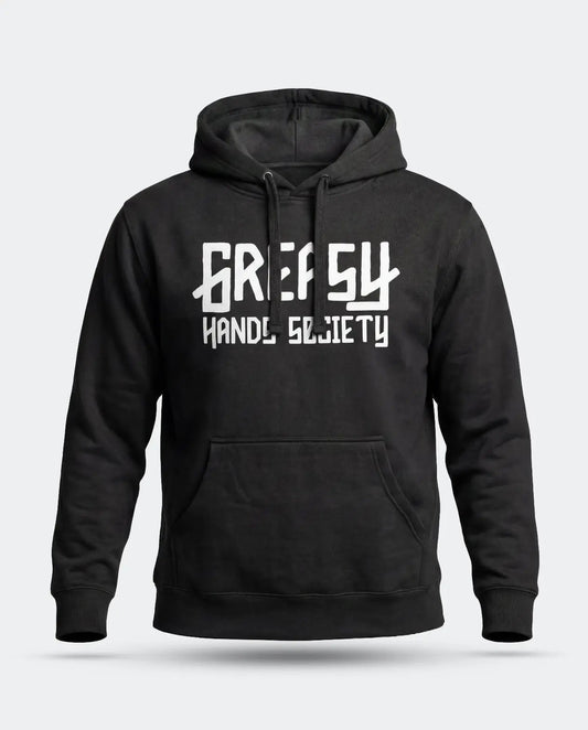 A black pullover hoodie with a white graphic print of the Greasy Hands Society logo on the chest reading 'GREASY HAND SOCIETY' in a stylized font, shown against a light gray background - The GHS Logo Hoodie by Greasy Hands Society