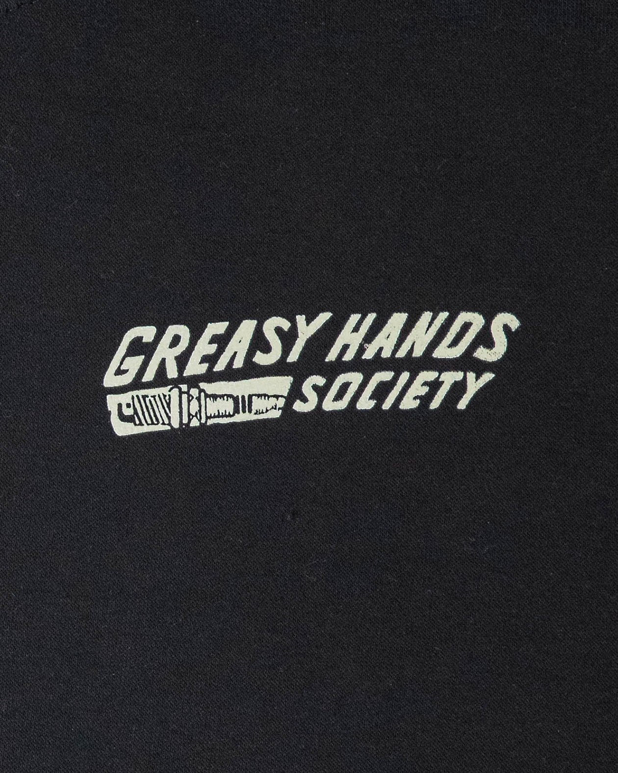 bolted down black heavyweight hoodie front detail view showing greasy hands society with a screw graphic