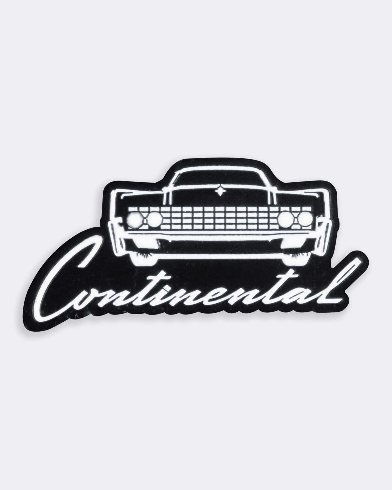 lincoln continental black and white enamel pin on gray background