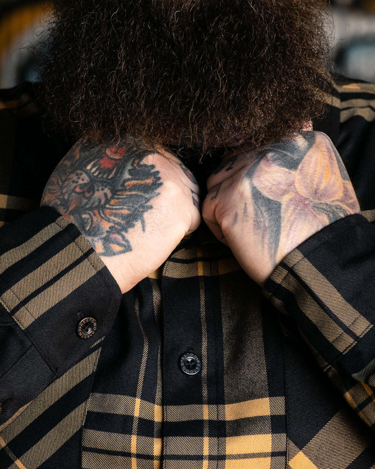 two-lane flannel showing the front of the black and gold flannel