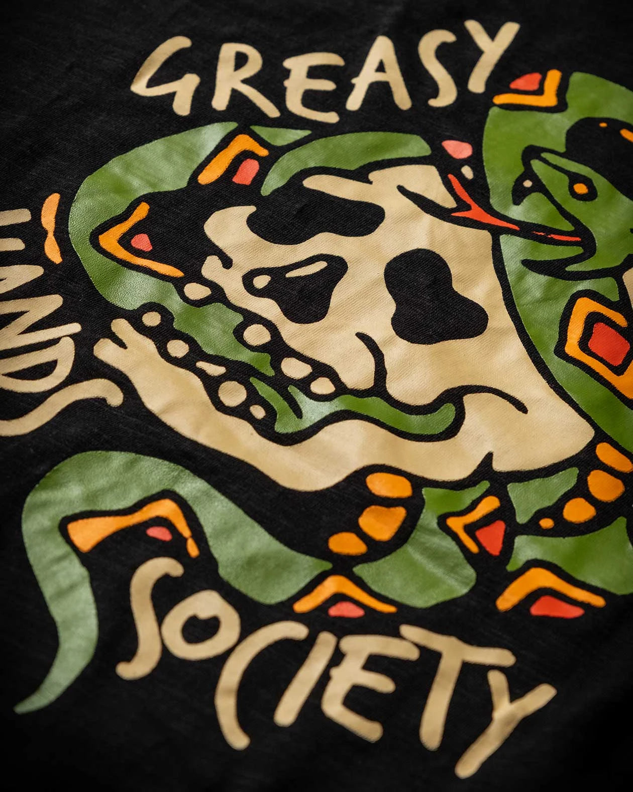 pressure t-shirt back graphic detail of a snake coiled around a skull