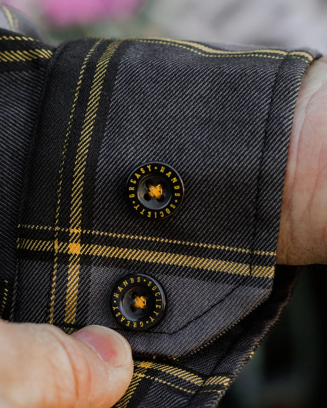 barrel cuff detail on the El Lobo orange and gray plaid pattern Flannel