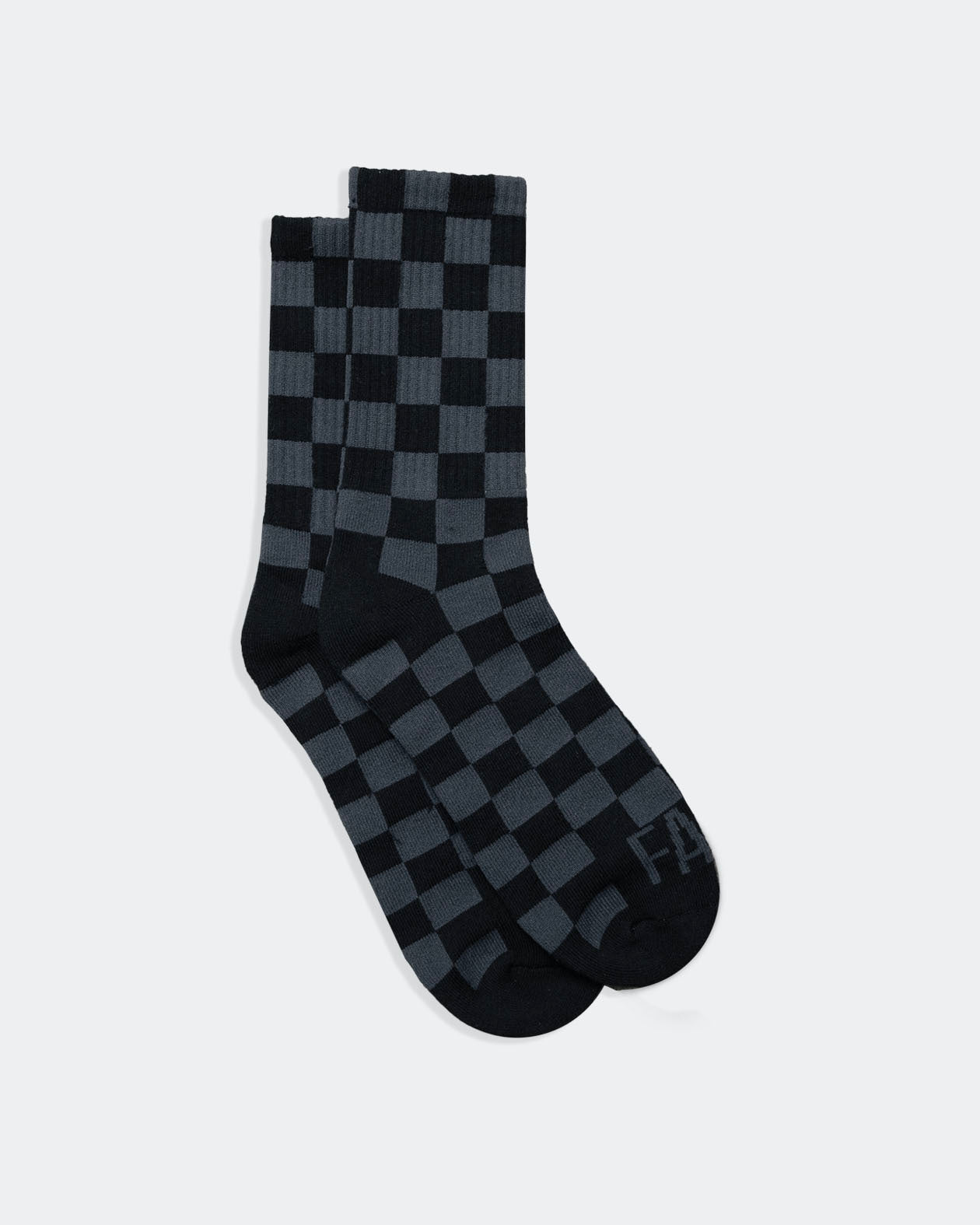 Black and gray checkered socks on a white background from greasy hands society