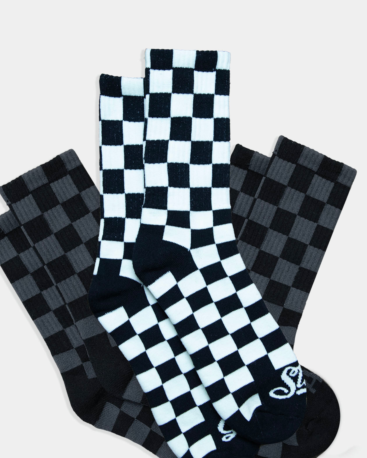 3-pack of black and gray and black and white checkered crew socks from greasy hands society