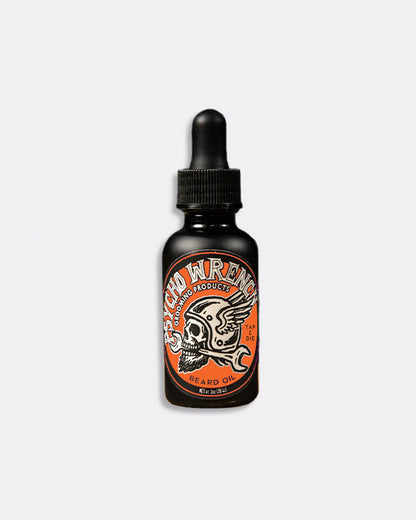 Black bottle of Psycho Wrench beard oil with orange label on a white background - Psycho Wrench Tap & Die Beard Oil by Greasy Hands Society