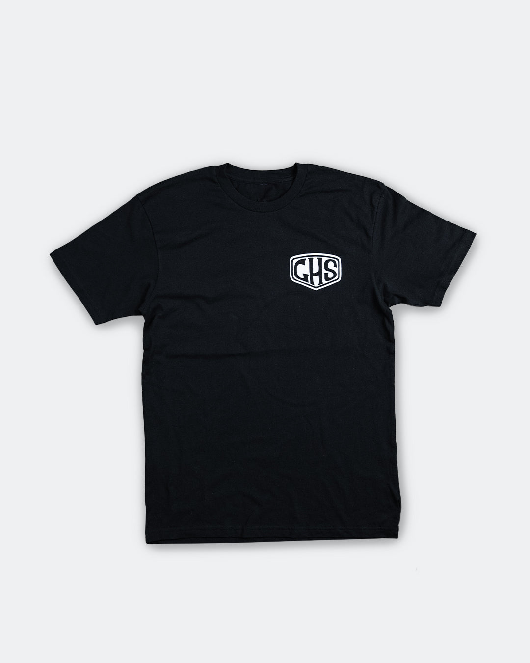 factory sealed black graphic t-shirt with a GHS shield on the front left packet. 