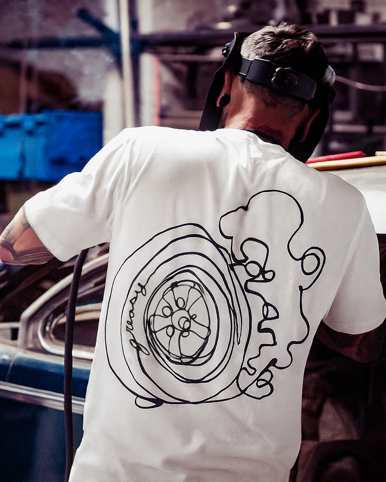 break loose white tee with a back graphic of a car wheel