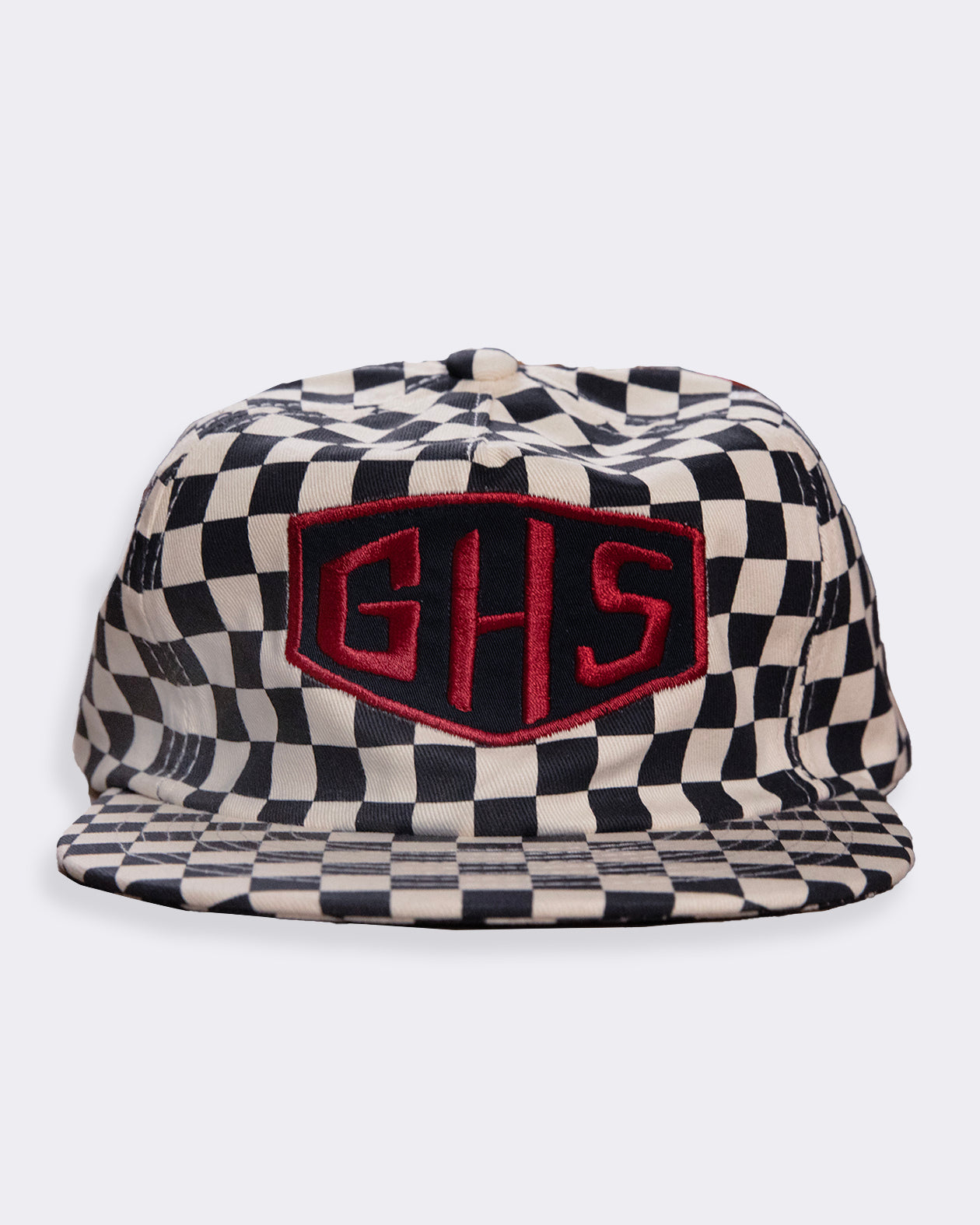 Checkered cap with red logo on a white background