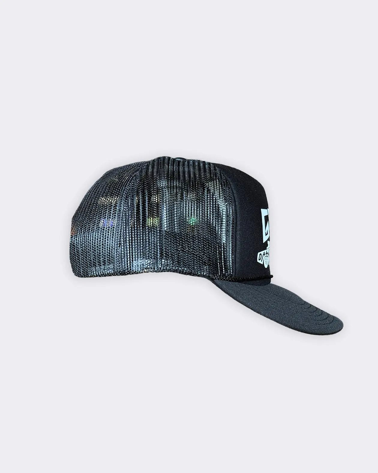 A black trucker-style cap with a black mesh back and a solid black visor, featuring a white graphic logo on the side, set against a light gray background - Dallas Dragster Black/White Hat by Greasy Hands Society