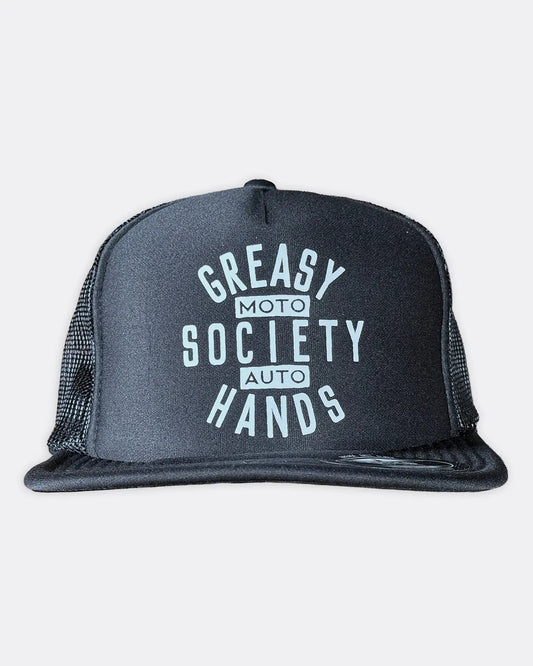 A black trucker hat with a white graphic print reading 'Greasy Hands Society - Moto - Auto' on the front panel, set against a light gray background - Black Station Hat by Greasy Hands Society