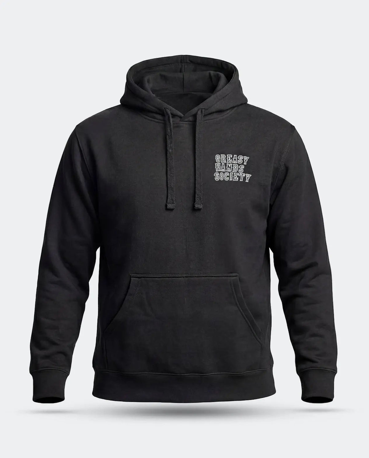 A black pullover hoodie with a small white distressed text graphic reading 'GREASY HANDS SOCIETY' on the left chest, displayed on a light gray background - Eat Dust Hoodie by Greasy Hands Society