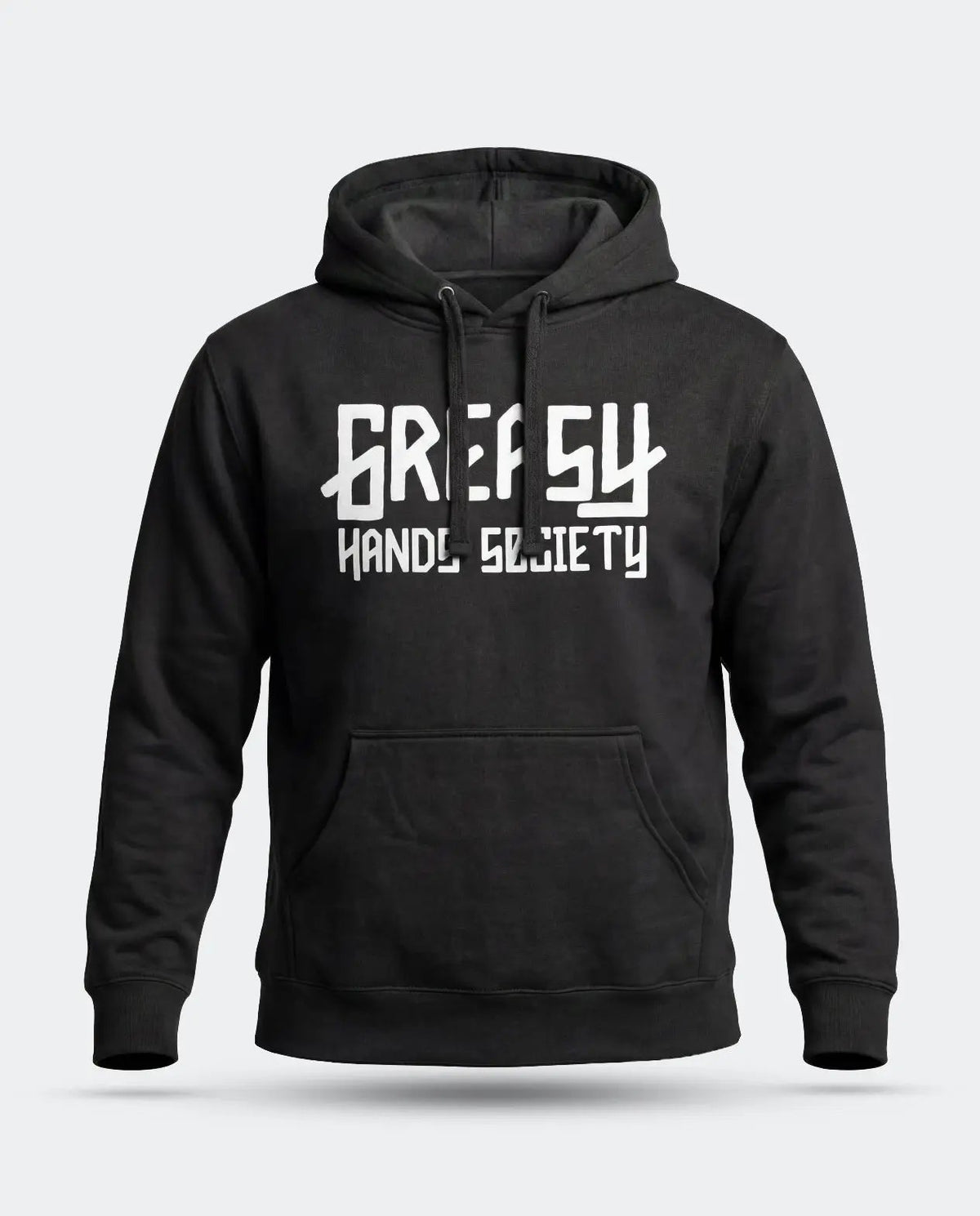 A black pullover hoodie with a white graphic print of the Greasy Hands Society logo on the chest reading 'GREASY HAND SOCIETY' in a stylized font, shown against a light gray background - The GHS Logo Hoodie by Greasy Hands Society