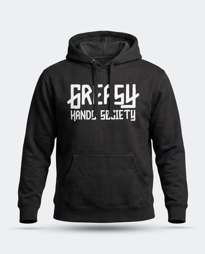 A black pullover hoodie with a white graphic print of the Greasy Hands Society logo on the chest reading 'GREASY HAND SOCIETY' in a stylized font, shown against a light gray background - The GHS Logo Hoodie by Greasy Hands Society