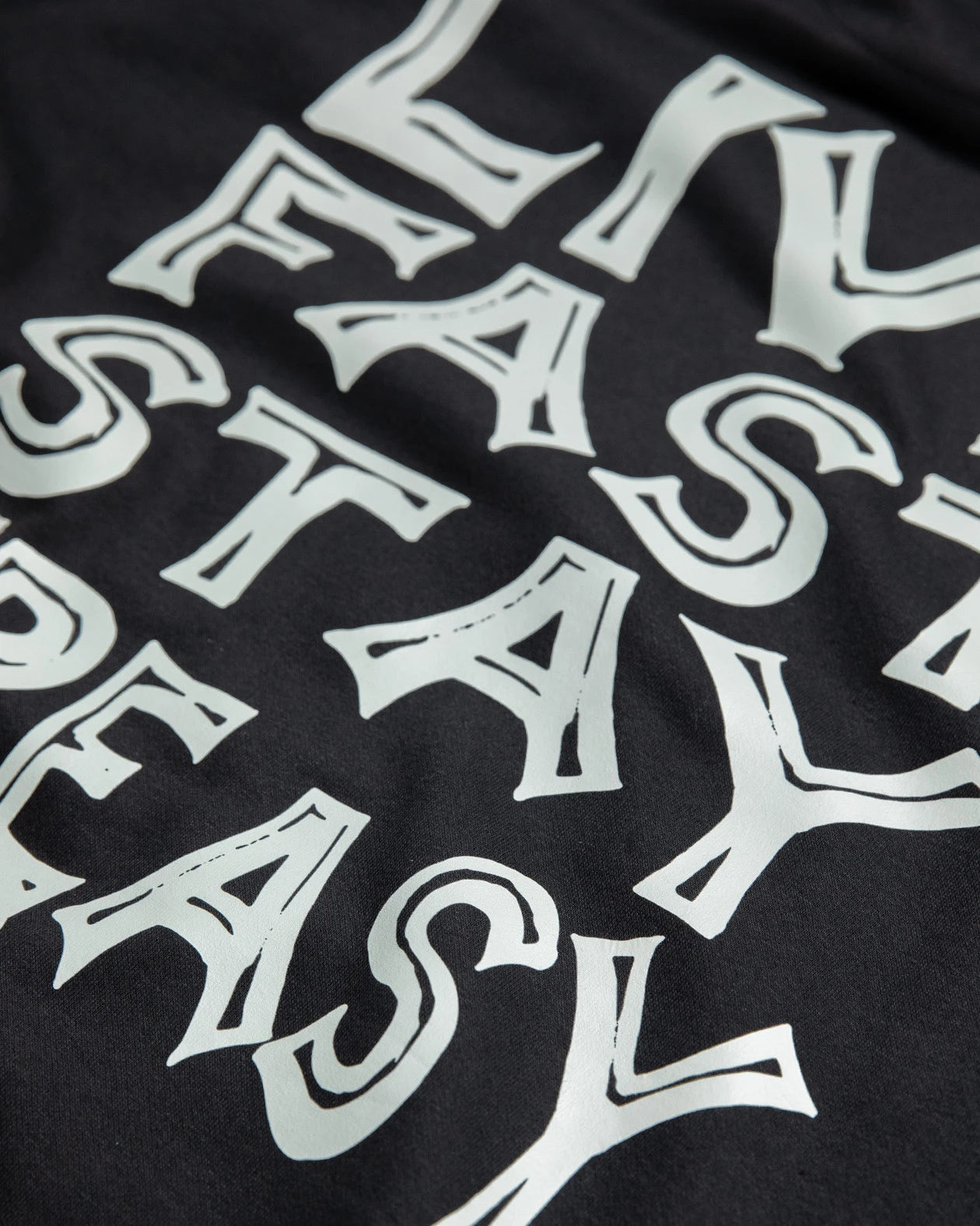 live fast stay greasy full back graphic detail on a black hoodie