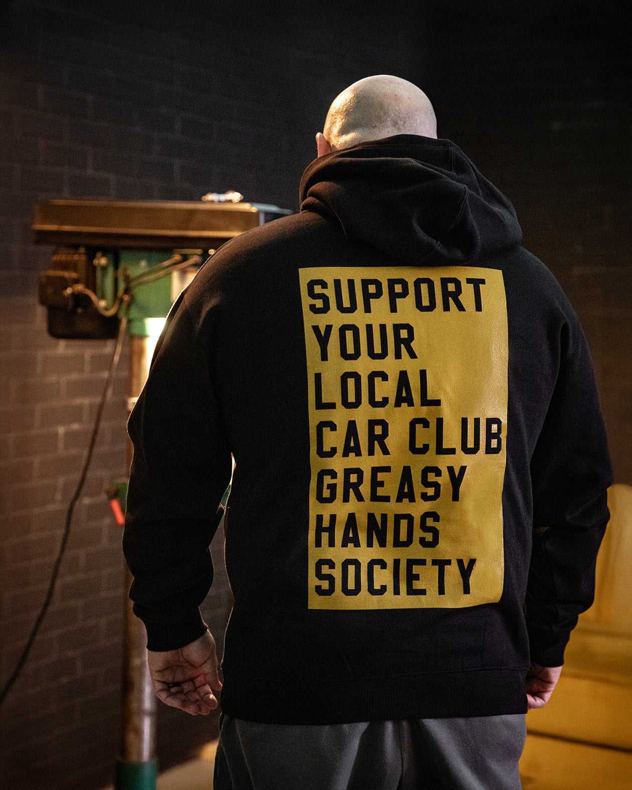 support your local car club black heavyweight hoodie with full back rectangle graphic on a model