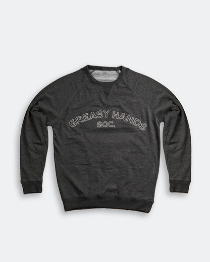 Dark gray sweatshirt with 'Greasy Hands Soc' text on a light gray background