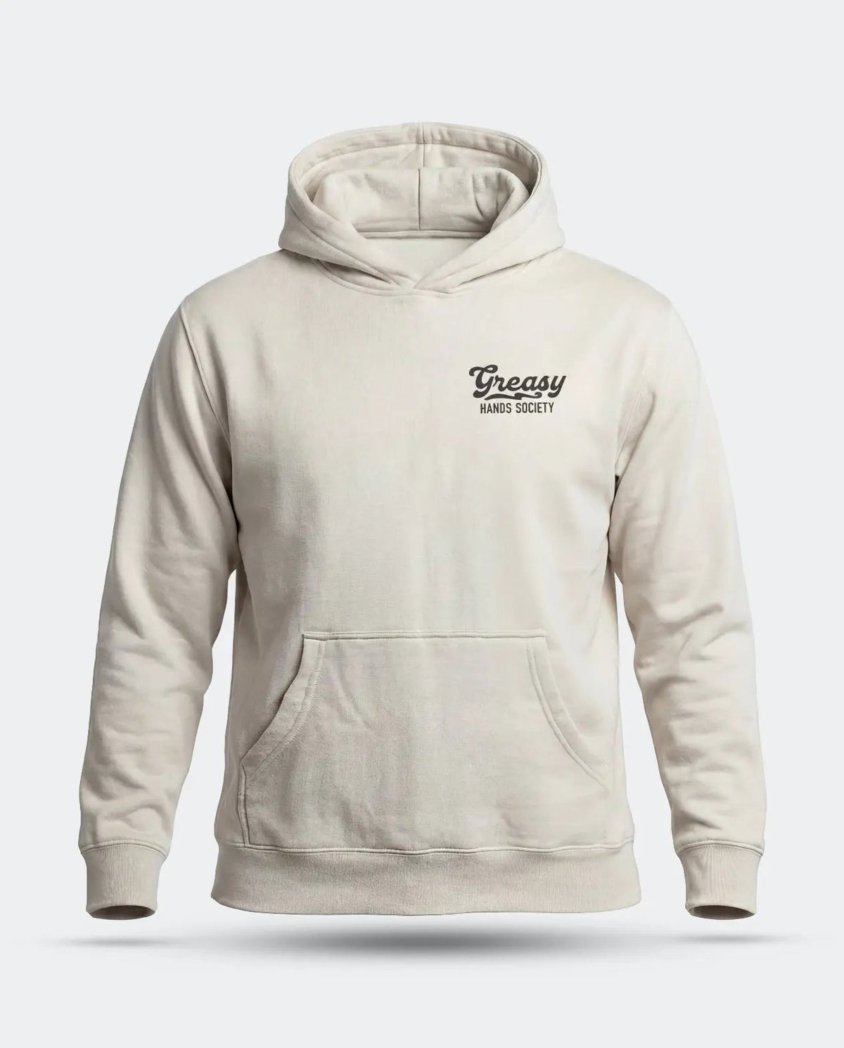 A light beige pullover hoodie with a small black 'Greasy Hands Society' logo on the left chest, displayed on a clean light gray background - Men's Destination Hoodie by Greasy Hands Society