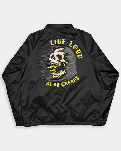 live loud back flat lay showing a skull with lightning