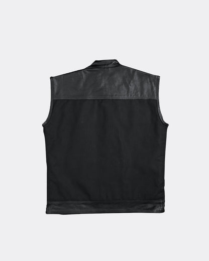 back of a Black leather and canvas vest on a light gray background