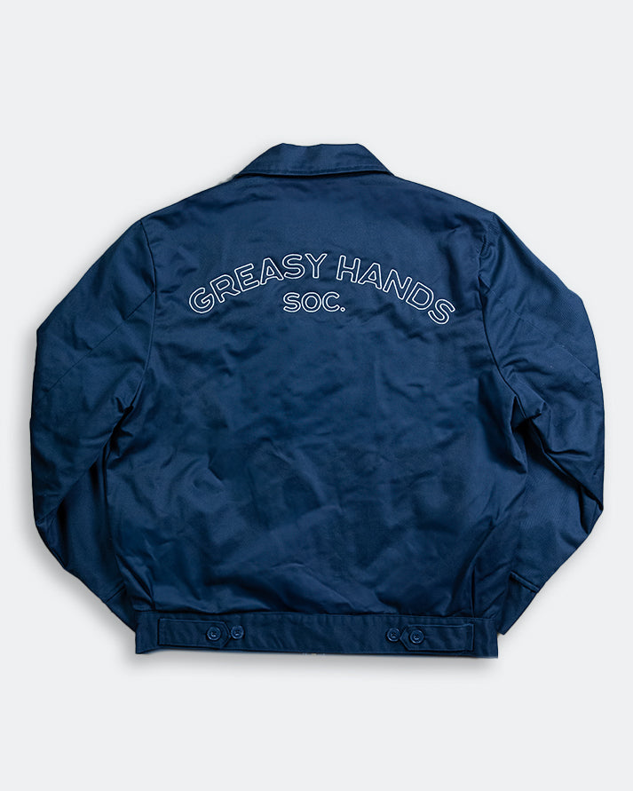 back graphic of Navy blue jacket with 'Greasy Hands Soc.' text on the back against a white background