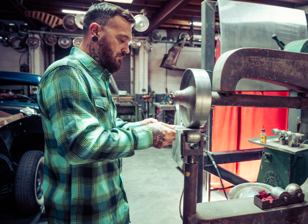 Man working on a lathe in a workshop - The Sucker Punch Flannel by Greasy Hands Society