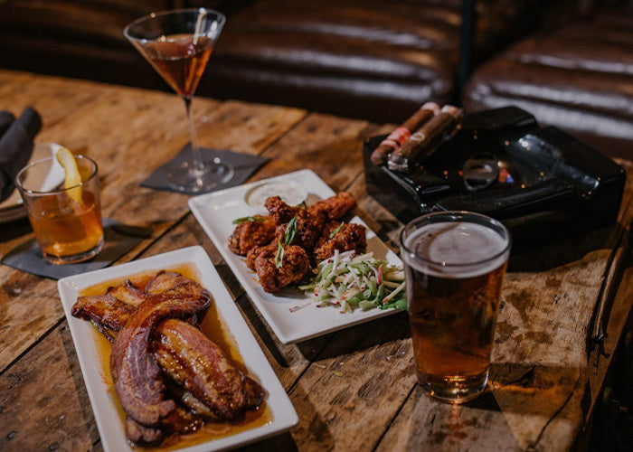 Plates of food and drinks on a wooden table