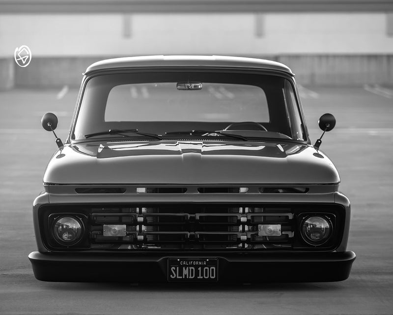 Back view of a silver Chevrolet truck on a gray background - Greasy Hands Society Lifestyle