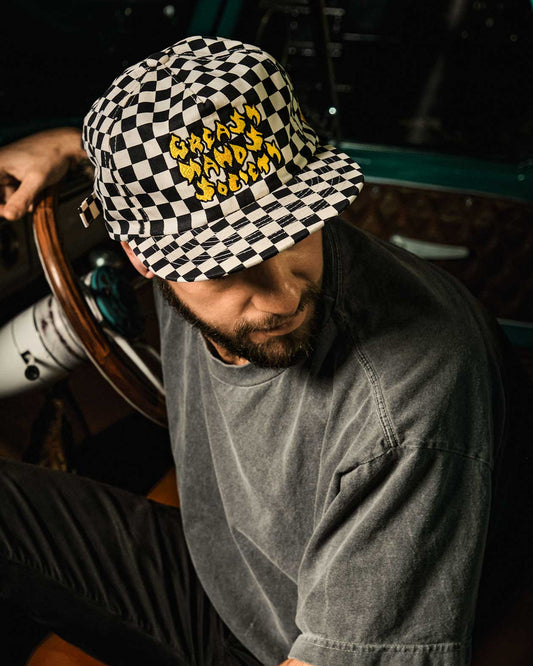 checkerboard pattern torch hat driving a truck