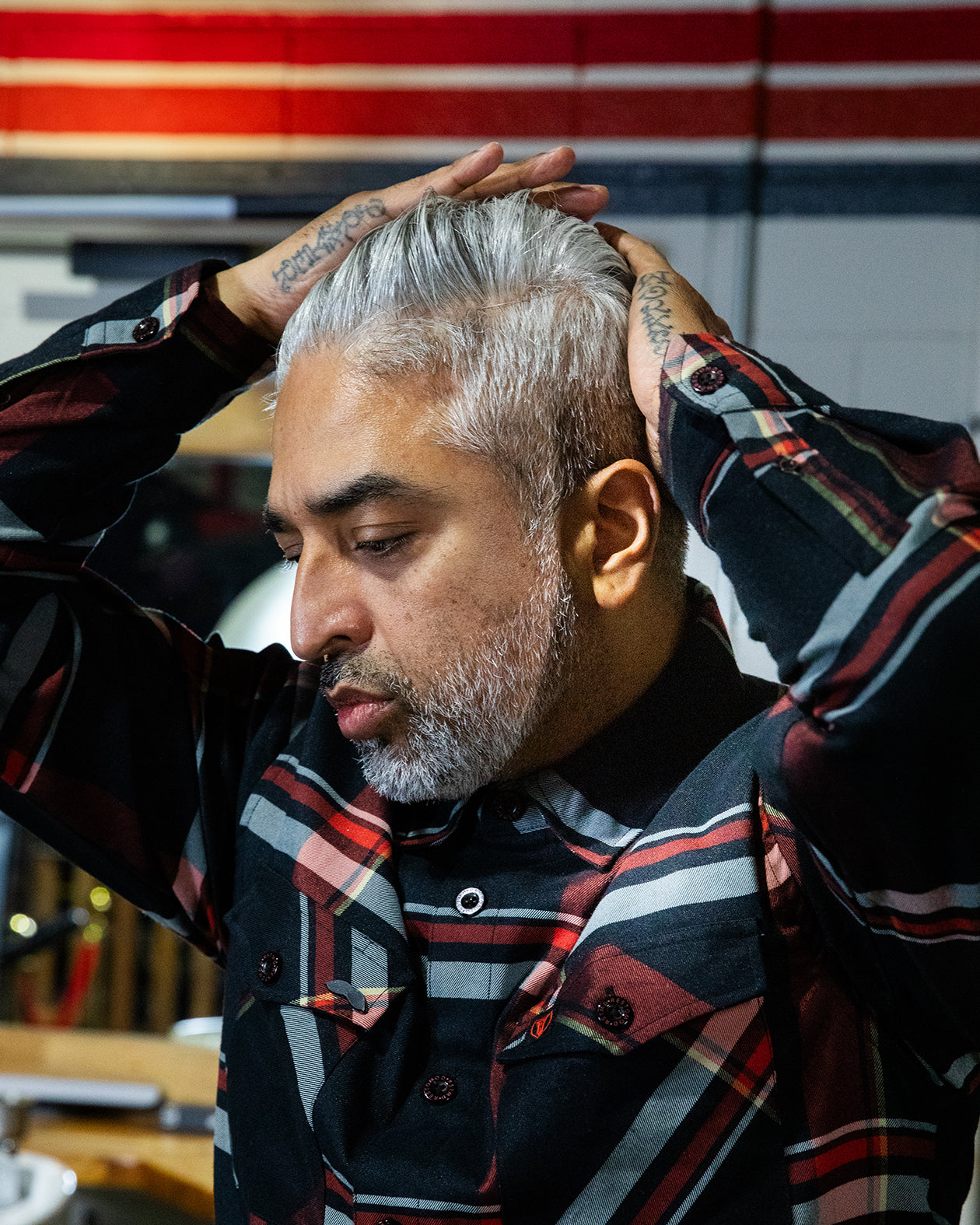 oil pomade model shot with dappa dan - psycho wrench grooming products oil and grit oil-based pomade for a classic high-shine