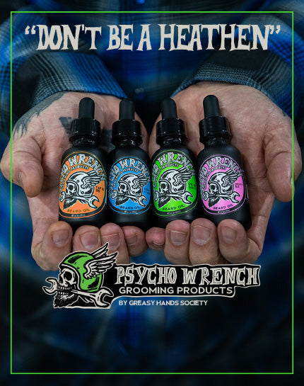 Hands holding four small bottles of Psycho Wrench beard oil showing the different scents of green- oil & grit, blue - cold start, pink - smooth idle, and orange - tap & die. Psycho wrench grooming products by greasy hands society
