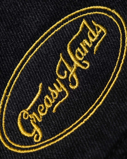 greasy hands society patch on the black denim jacket