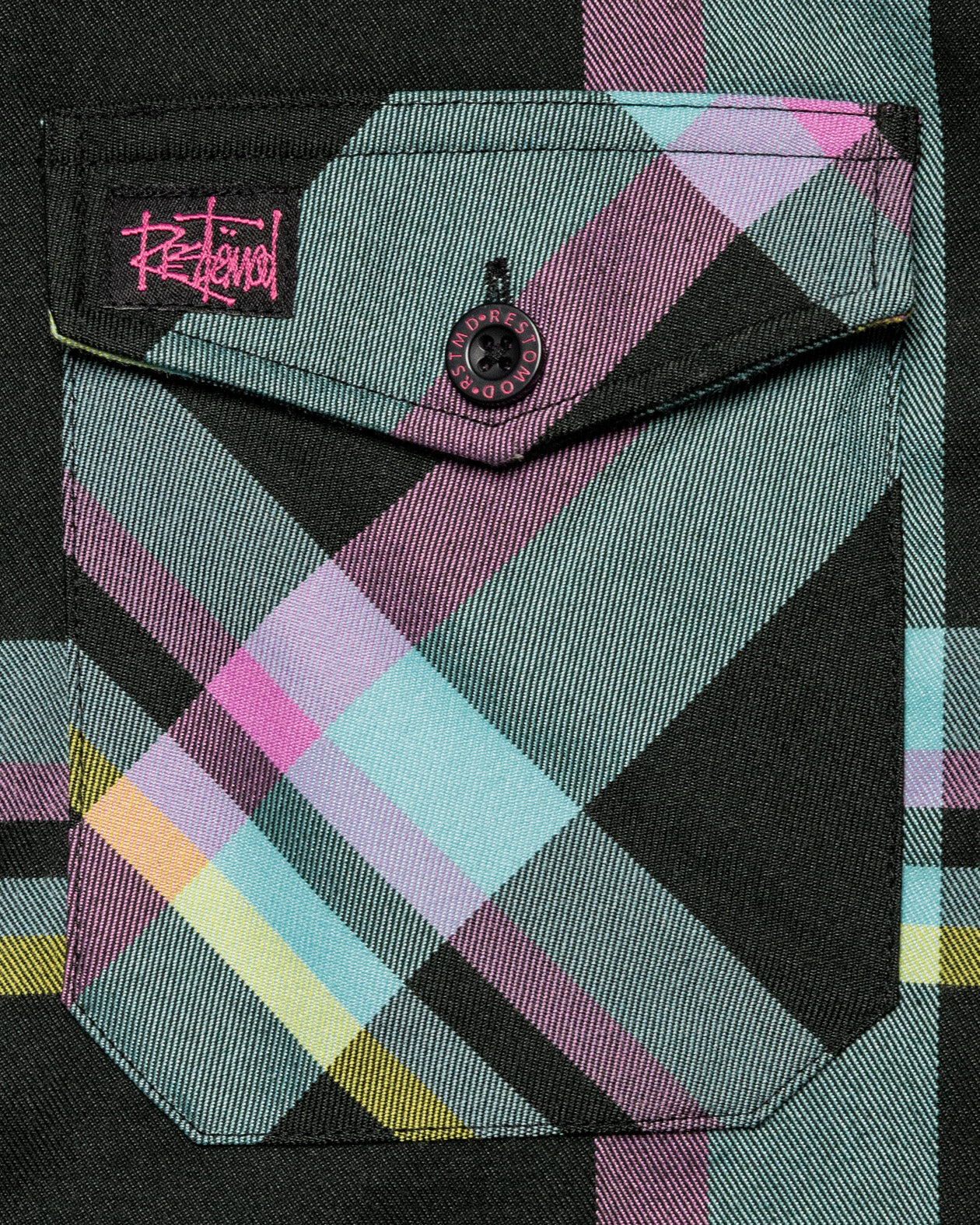 pinstriper flannel closeup on the front pocket black, blue, pink and yellow flannel