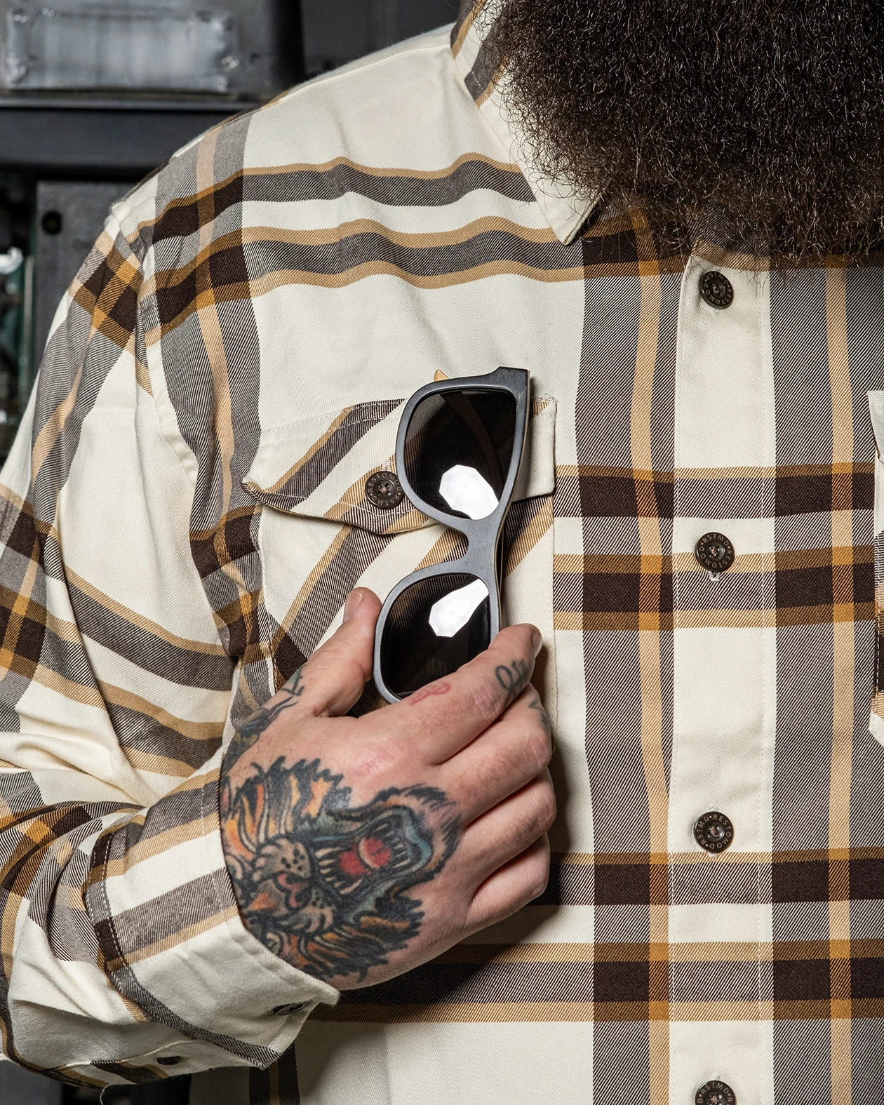 The Whiskey Flannel showing the front pocket with sunglasses