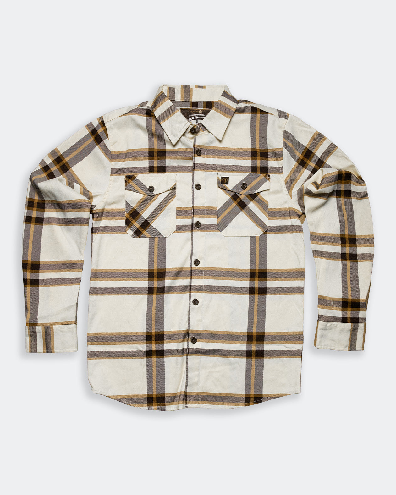 The Whiskey Flannel cream brown and gold flannel flat lay on gray 