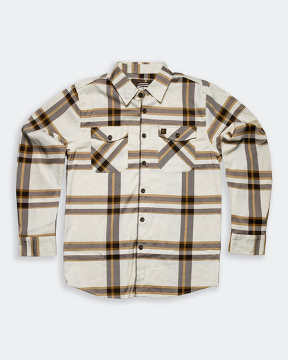 The Whiskey Flannel cream brown and gold flannel flat lay on gray 