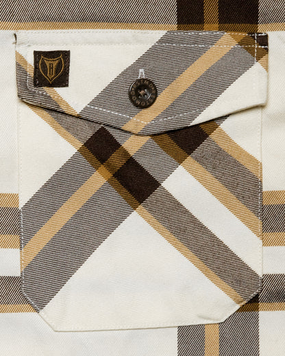 The Whiskey Flannel front pocket detail on cream brown and gold flannel