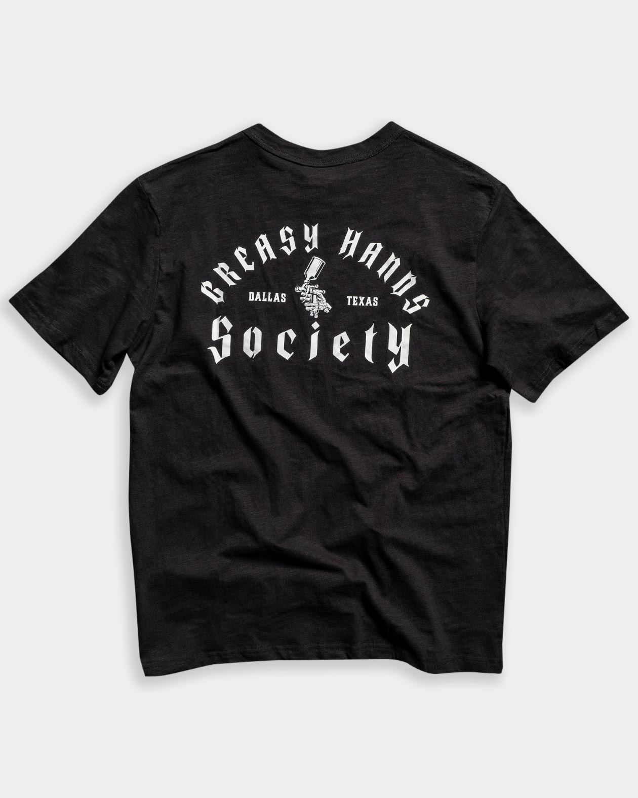 gravity fed black tee full back graphic flat lay on gray