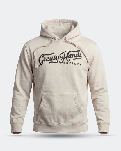 A cream-colored pullover hoodie with a black graphic print reading 'Greasy Hands Society' across the chest, displayed on a clean light gray background - Greasy Hands Society Script Hoodie by Greasy Hands Society