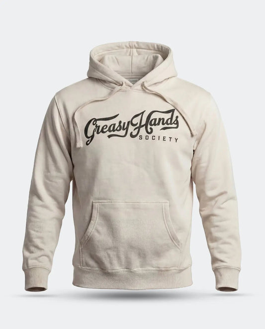 A cream-colored pullover hoodie with a black graphic print reading 'Greasy Hands Society' across the chest, displayed on a clean light gray background - Greasy Hands Society Script Hoodie by Greasy Hands Society